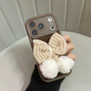 Handmade Crochet iPhone 16 case with a delicate 3D bow accent, showcasing intricate stitching and a cozy, textured finish.