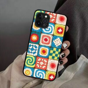 A bright and colorful granny square crochet case for iPhone, featuring a classic geometric stitch pattern in vibrant yarn colors.