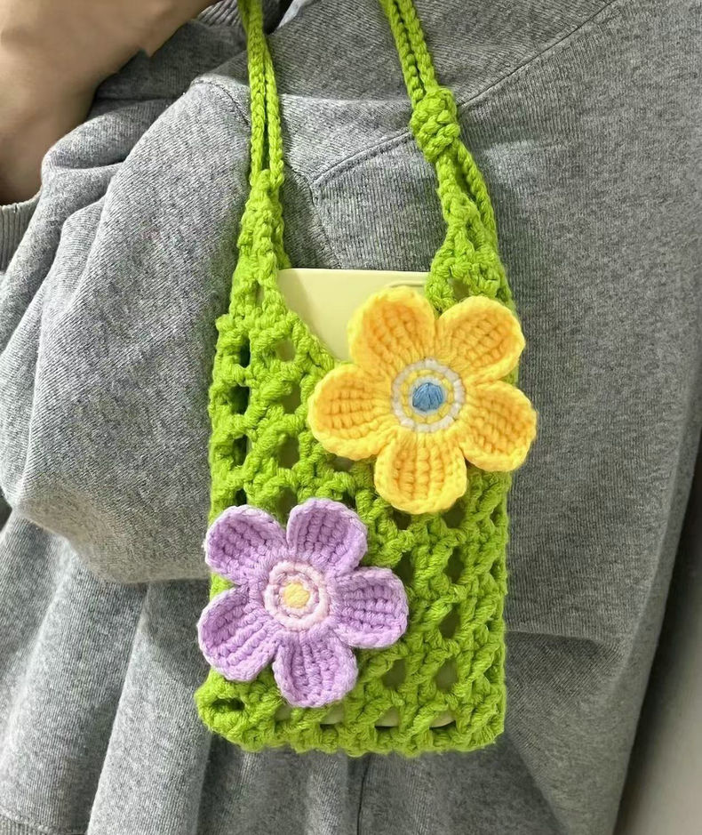 Hand-crocheted cell phone pouch with vibrant flower motif, lightweight cotton crossbody bag, perfect for carrying phone, cards, and small items.